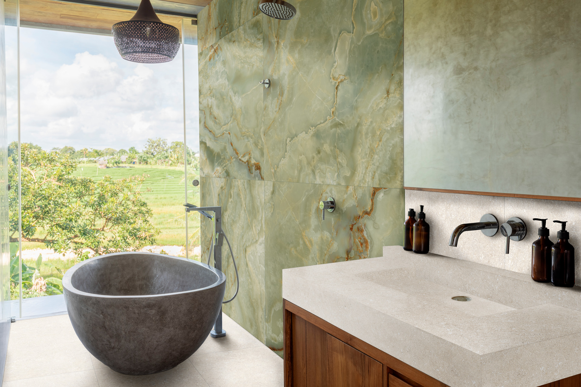 Dramatic green onyx feature wall in a bathroom